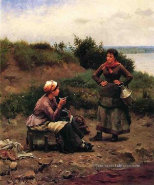 Une discussion entre deux jeunes demoiselles Daniel Ridgway Knight Peinture à l'huile